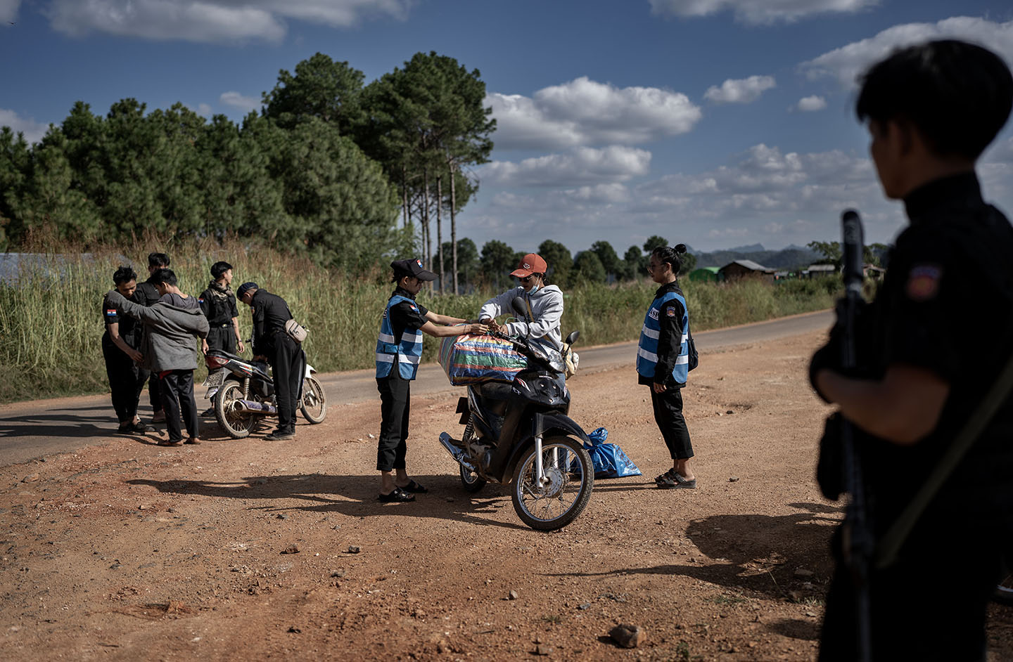 Multiple officers check people and motorcycles